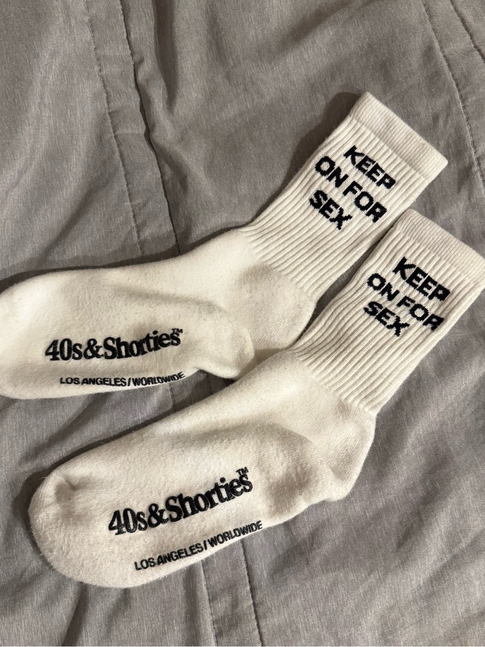 40s & Shorties white crew socks featuring a printed "Keep On For Sex" slogan